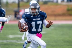 SAU football player running with the ball